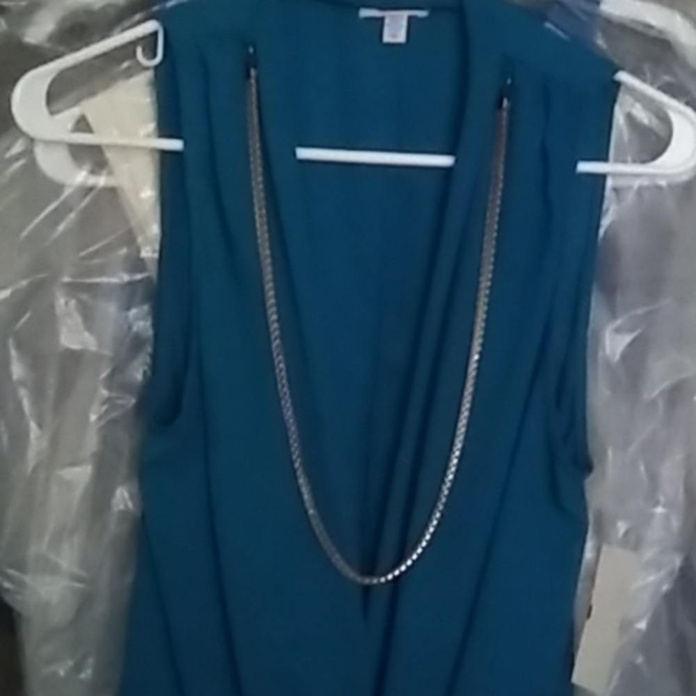 Brand Bongo. Blouse new sleeveless with tags. Size medium color turquoise blue.